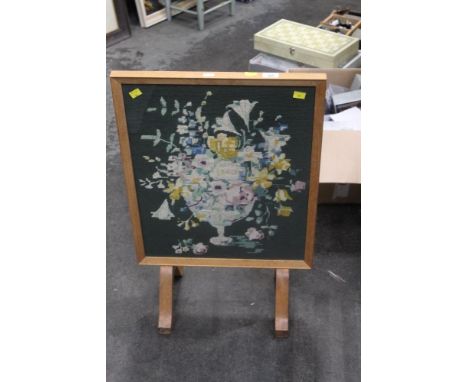 A needlework fire screen 
