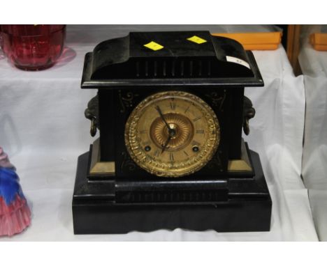 Late 19th/early 20 the century mantle clock with black metal body and gilt face