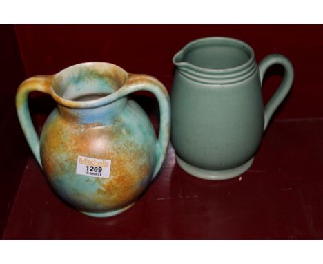 A pottery two-handled vase of Radford style with mottled orange, blue and green glaze, 17 cm high and a Langley green glazed 