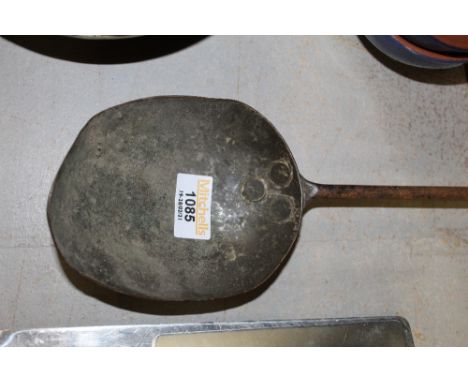 An interesting old hammered steel ladle, 57 cm long. 