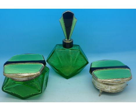 A three piece Art Deco silver mounted and enamel, green glass dressing table set, scent, jar and trinket box, Birmingham 1932