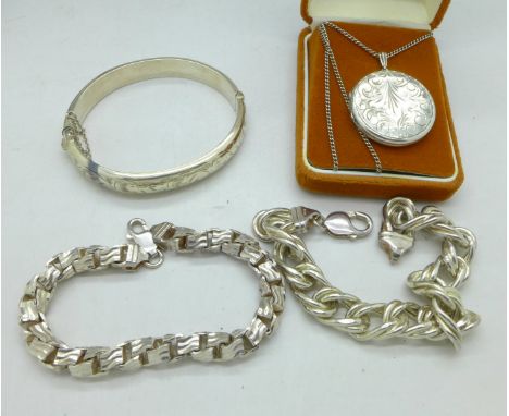 Two silver bracelets, a silver bangle and a silver pendant and chain