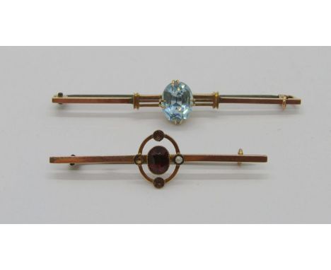 Edwardian 9ct garnet and seed pearl bar brooch (3 of 4 seed pearls vacant) and a similar claw set blue paste example, 4.4g to
