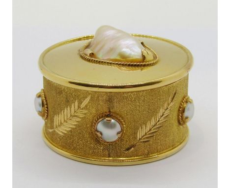 Circular yellow metal (believed to be high carat gold) trinket box set with a baroque blister pearl to the lid and five butto