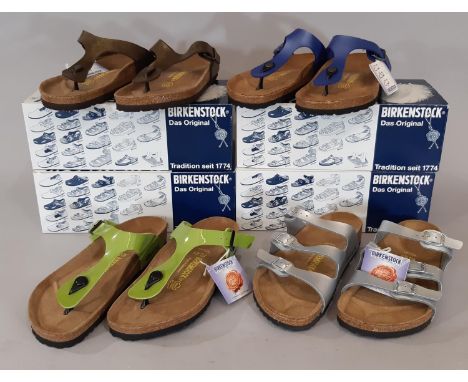 4 pairs boxed and unworn Birkenstock sandals including Gizeh sandals in Peridot -green, gold- brown, and ice pearl opal, and 