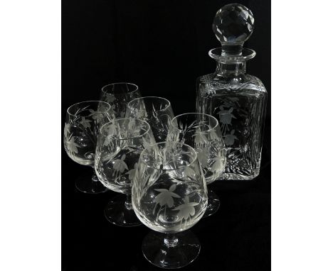 A Stuart Crystal Glass square brandy decanter with engraved floral decoration and six matching brandy balloons. 