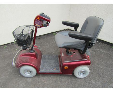 A Shop rider Deluxe model four wheeled mobility scooter complete with Pihsiang fully automatic battery charger (working order