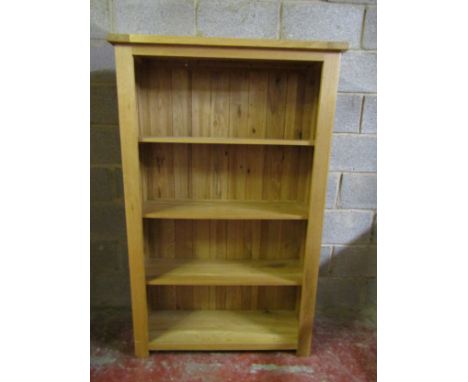 A good quality contemporary light oak floorstanding open bookcase with fixed shelves and boarded back, 156 cm high x 98 cm wi