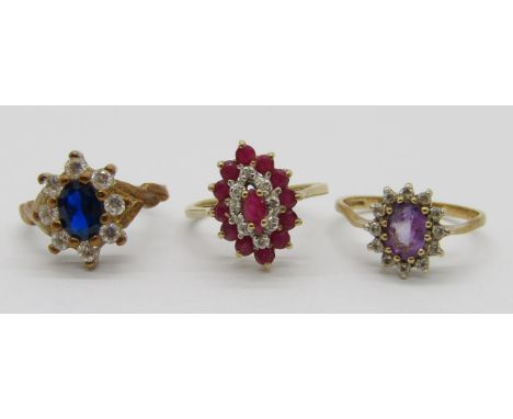 Three vintage 9ct gem cluster dress rings to include a ruby and diamond example, size L, 7.6g total 
