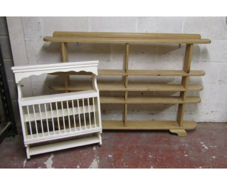 A narrow stripped pine freestanding open shelf unit raised on bracket supports, 93cm high x 153cm long x 17cm deep together w