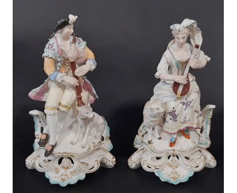 A pair of 18th century Derby figures of a shepherd and shepherdess, with pipe and lute, hand painted detail and raised on pie