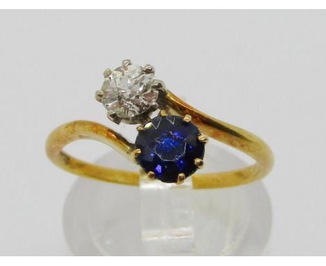 18ct sapphire and diamond crossover ring, sapphire 0.50ct approx, diamond 0.25ct approx, size M, 2.5g