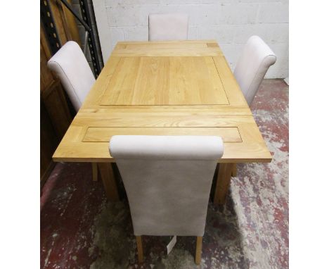 An Oak Furniture Land light oak drawer leaf dining table with panelled top raised on square cut supports, the top 90 cm squar