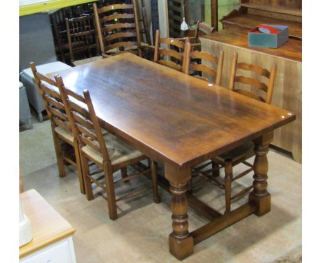 A good quality oak refectory dining table in the 18th century style, 81cm high, 196 x 98cm, together with eight associated tr