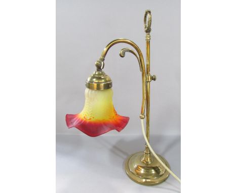 An Edwardian period brass adjustable students lamp (glass shade cracked) and a vintage TWA flight bag. 