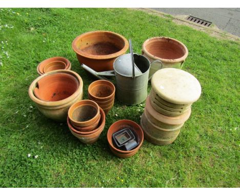 A large garden collection to include a octagonal weathered cast, composition stone planter (planted with well-established Bay
