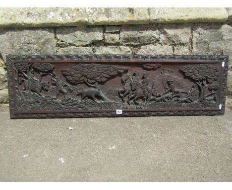 A large carved and finely detailed Victorian panel, detailing a hunting scene, 34 x 120cm. 
