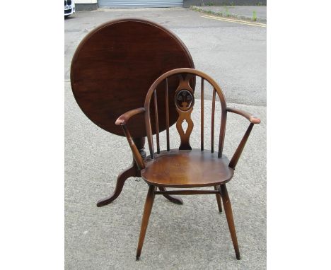 A vintage Ercol dark stained elm and beechwood hoop and stick back open elbow chair with pierced splat, together with a mahog