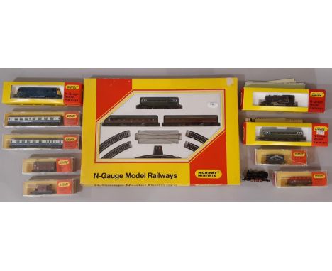 A collection of boxed N gauge railway models by Hornby Minitrix including 102 Passenger Set, N205  2-6-2 locomotive 41234 in 