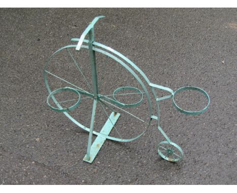A painted novelty light steel garden flower pot stand in the form of a penny farthing or ordinary cycle, 70 cm high approx x 