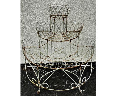 A weathered Victorian style wire work freestanding three tier conservatory/garden planter with lattice and open scroll work d