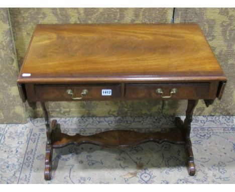 A good quality reproduction miniature mahogany sofa table of diminutive proportions, with twin frieze drawers and shaped supp