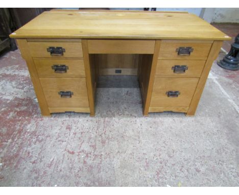 A good quality contemporary light oak Arts &amp; Crafts style kneehole twin pedestal office desk, fitted with an arrangement 