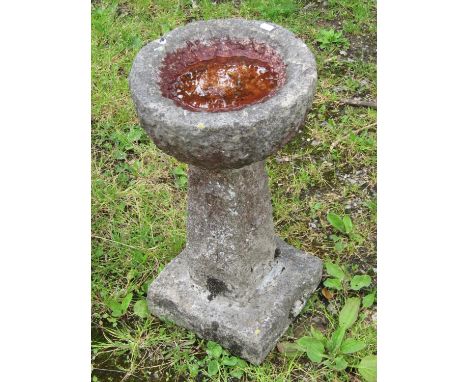 A small weathered three sectional carved stone bird bath with circular top 55 cm high x 28 cm diameter together with a furthe