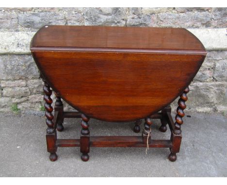 An antique oak gate-leg dining table, barely twists supports, 73cm high, 90 x 122cm (maximum) 
