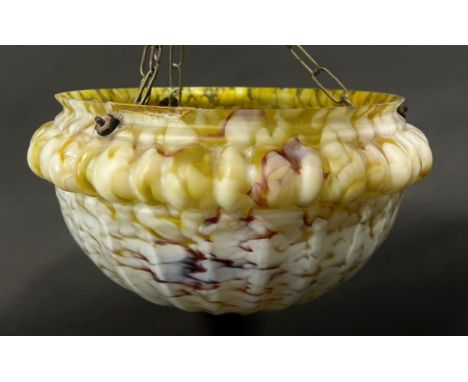 An early 20th century marbled ‘jelly mould’ glass light shade with three hanging chains, 30cm diameter. 