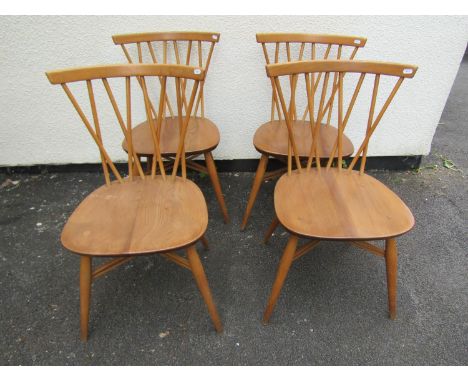 A set of four vintage Ercol elm and beech ‘candlestick’ chairs 