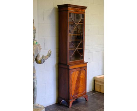 *Bookcase. George III style mahogany bookcase,  of slender proportions, the key frieze above single astragal glazed door, enc