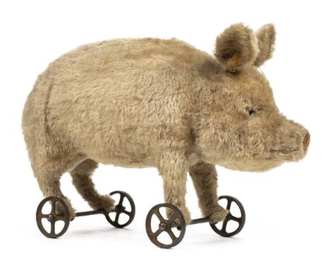 *Steiff. Pig on wheels, Germany, circa 1905/6,  stuffed blonde mohair pig, with black boot button eyes, and velvet snout with