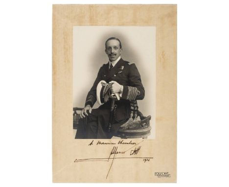 *Alfonso XIII (1886-1941, King of Spain). Signed photograph, 1926,  three-quarter length portrait of the seated King in unifo