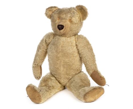 *Teddy. A large teddy bear, Chad Valley, circa 1930,  a jointed light golden mohair teddy bear with protruding snout (stitchi