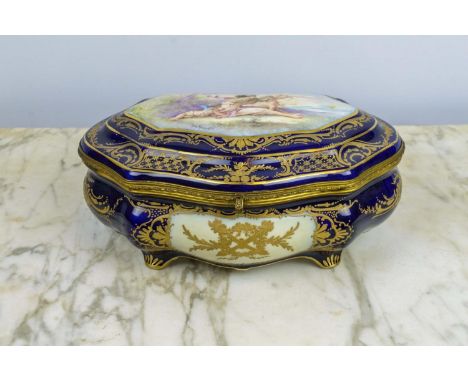 SERVES STYLE PORCELAIN BOX, late 19th century, by Chateau Des Tuileries, with cobalt blue ground and gilt decoration with cup