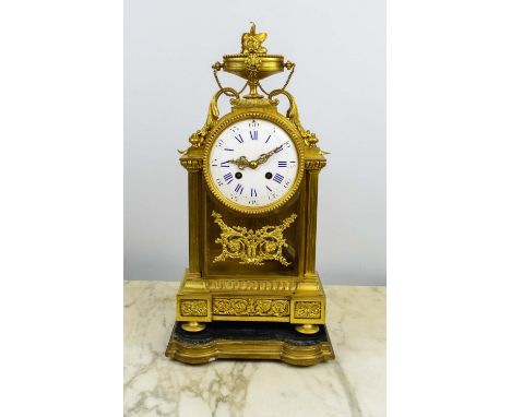 FRENCH 19TH CENTURY GILT MANTLE CLOCK, on shaped fitted wooden and gilt stand, 44cm H. 