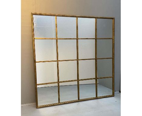 ARCHITECTURAL WALL MIRROR, 110cm high, 110cm wide, segmented overlaid gilt metal frame. 