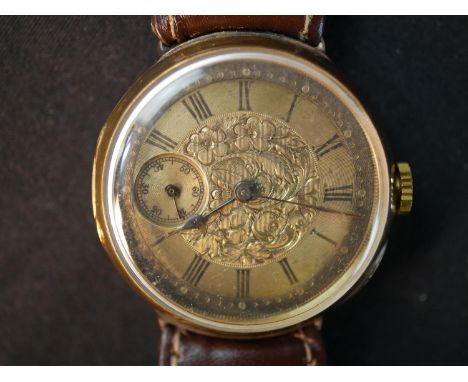 A yellow metal (tests as 9ct) Victorian automatic gentleman's wrist watch with small seconds dial. The back of the case with 