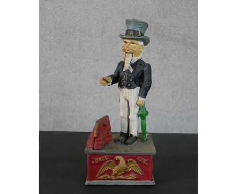 A 19th century style painted cast iron mechanical "Uncle Sam" money box, with push button action, the arm moves to drop the c