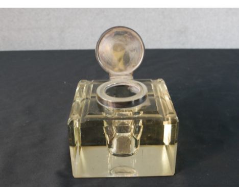 A large Victorian silver lidded cut glass inkwell, the top engraved with the monogram SH. Hallmarked: JG&amp;S for John Grins