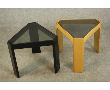Two Porada Arredi Italian occasional tables, circa 1970s, one light oak, the other ebonised, of wedge form with smoked glass 