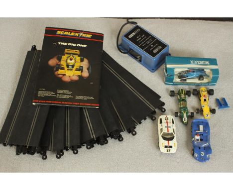 Five vintage Triang Scalextric cars (one boxed) along with control, track and manual. H.40 W.16cm. (largest). 