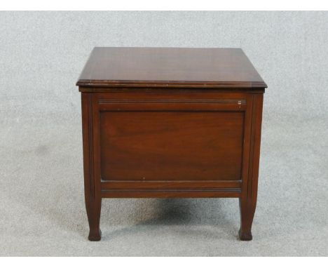 A late Victorian walnut commode, of square form, the lid revealing fitted ceramic interior. H.42 W.44 D.42cm 