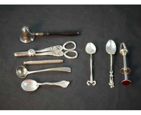A collection of silver cutlery, including a pair of silver and red enamel sprung ice tongs by Aksel Holmsen, a candle snuffer
