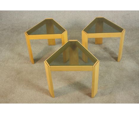 A set of three Porada Arredi Italian light oak occasional tables, circa 1970s, of wedge form with smoked glass tops. H.40 W.4
