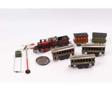 Small 0-gauge Items by Issmayer possibly with manufacturing assistance of Schönner: red 0-4-0 loco &amp; tender, one side cou