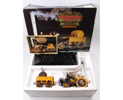 A Hornby 3.5" gauge live steam model of the Stephenson's Rocket, housed in the original packaging with some light use, and a 