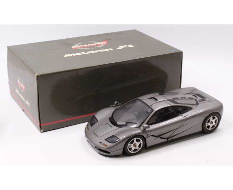 A Minichamps 1/12th scale No. 533 133124 McLaren F1 Road Car in dark silver, the model has been on display and would benefit 