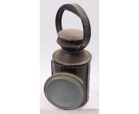 A London Transport interest railwayman's hand lamp marked LT to one side, would benefit from cleaning